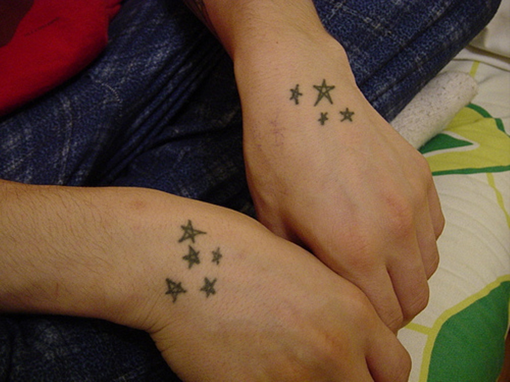 Red and Black Star Tattoo on Wrist - wide 8