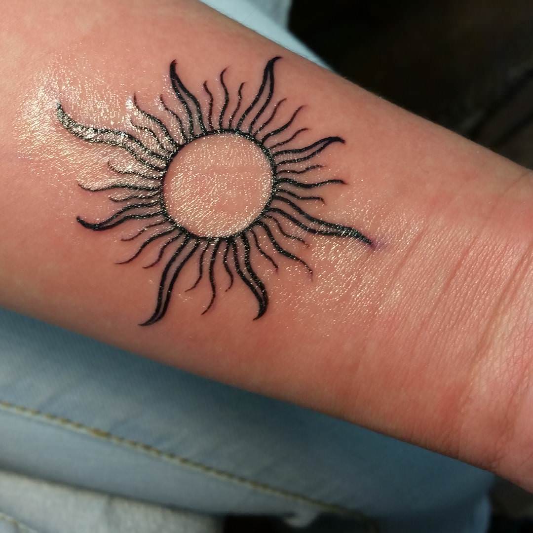 Black Sun Tattoo On Wrist Sun Tattoo Sun Tattoo Designs Sun Tattoos