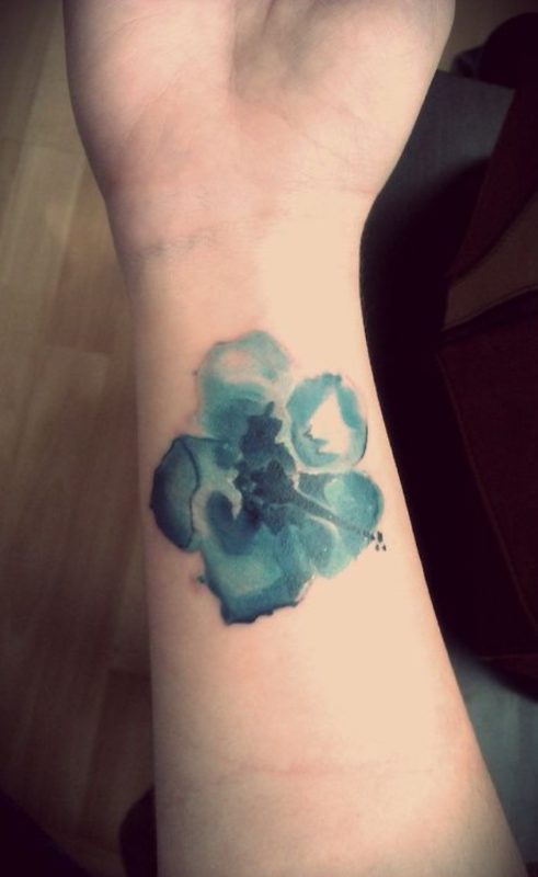 Abstract Flower Tattoo On The Wrist