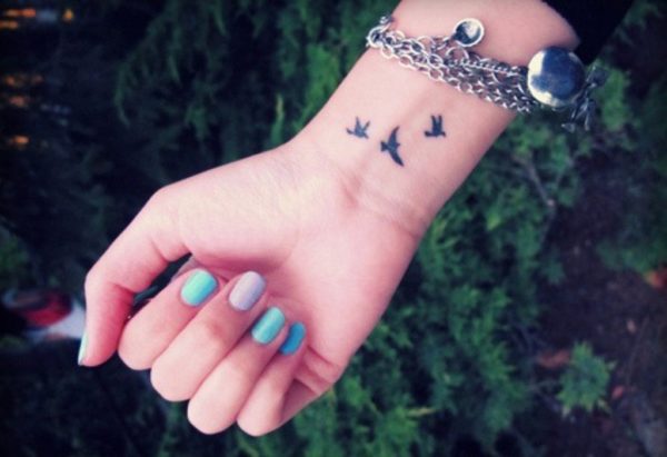 Attractive Black Birds Tattoo