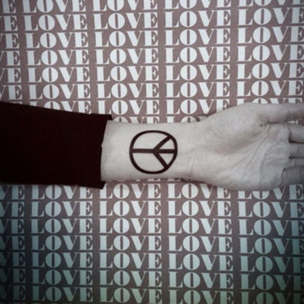 Attractive Peace Sign Tattoo