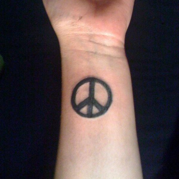 Attractive Peace Tattoo On Wrist