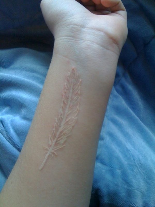 Attractive White Ink Feather Tattoo