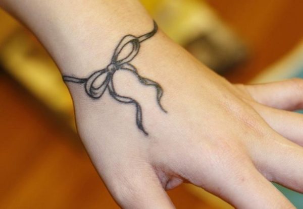 Awesome Bow Tattoo On Wrist