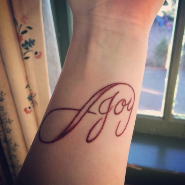 Beautiful Joy Wrist Tattoo