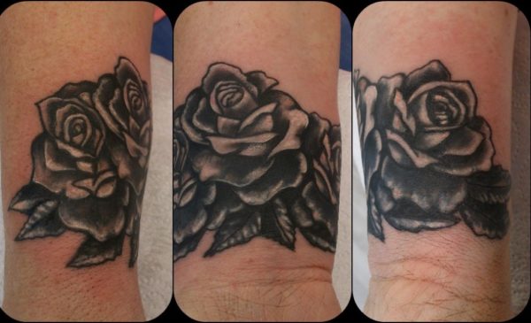 Black And Grey Flower Tattoo On Wrist