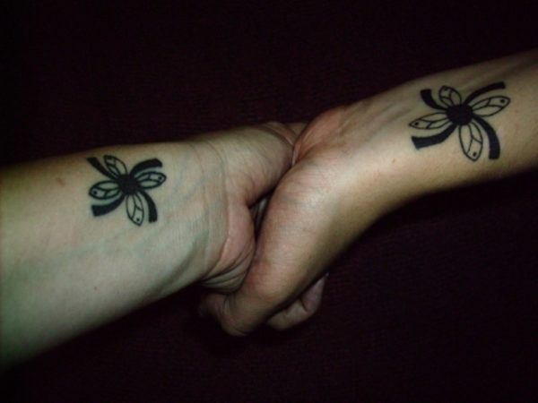 Black Flower Tattoo On Wrist 