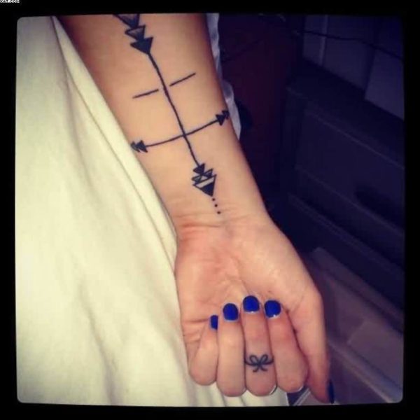 Black Ink Arrow Compass Tattoo On Wrist