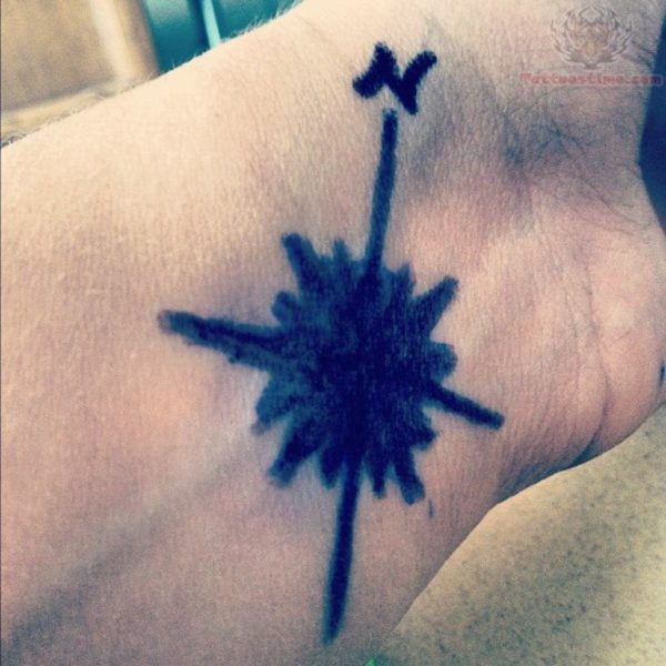 Black Inked Compass Tattoo