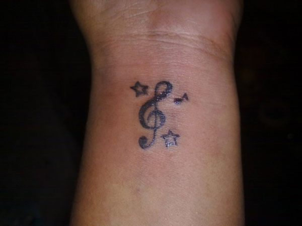 Black Stars And Music Note Tattoo