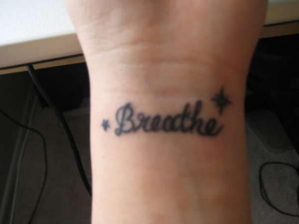 Black Word Breathe Tattoo
