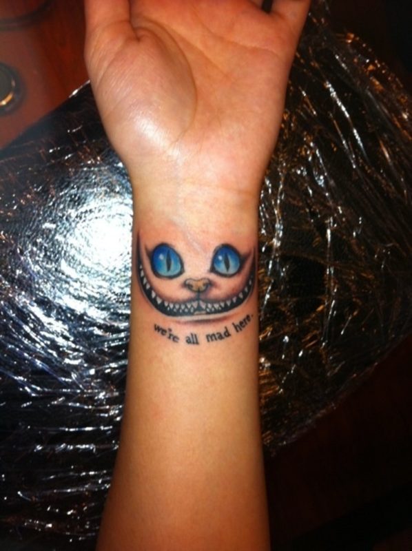 Blue Ink  Cat Tattoo On Wrist