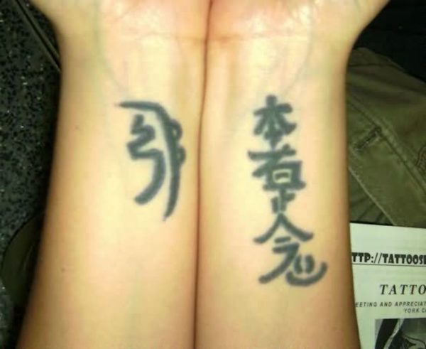 Chinese Symbols Wrist Tattoo