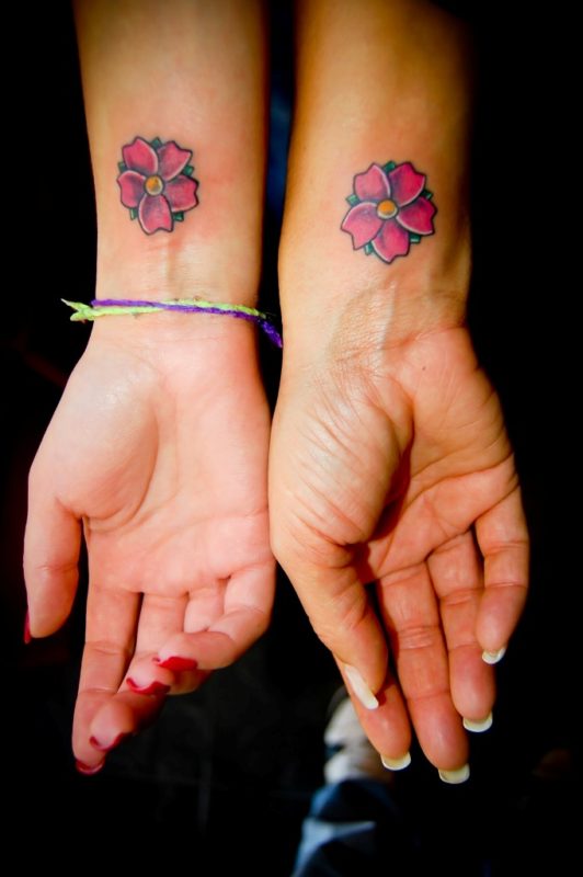 Colored Flower Tattoo On Wrist