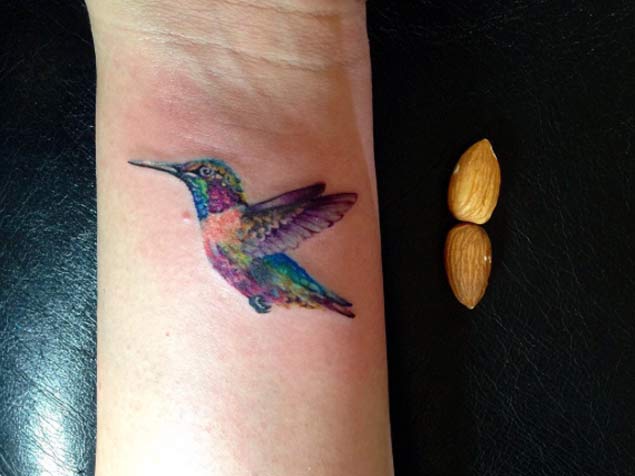 Colored  Hummingbird Tattoo On Wrist