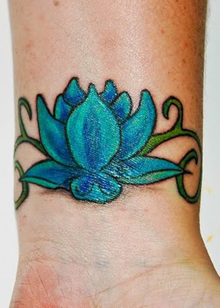 Colorful Lotus Tattoo On Wrist.