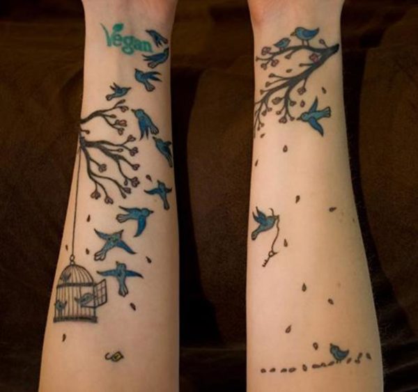 Colorful Birds And Vegan Tattoo On Wrist