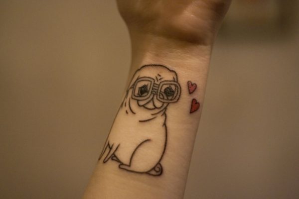 Cute Dog Tattoo On Wrist