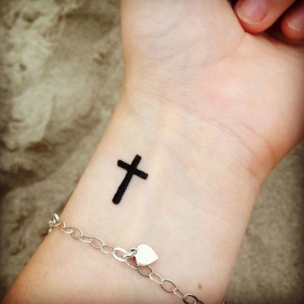 Dark Black Cross Tattoo On Wrist