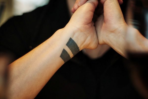 Dark Black Tattoo On wrist