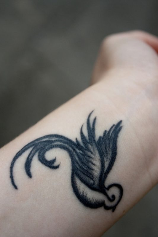 Elegant Bird Tattoo On Wrist 