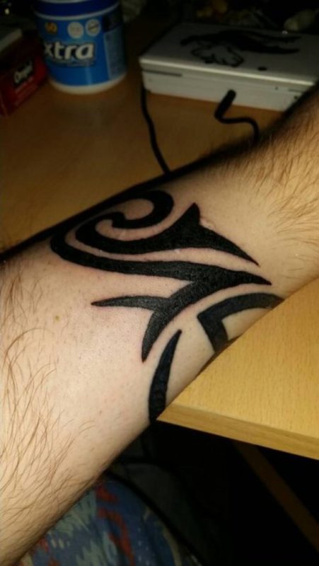 Fantastic Tribal Tattoo On Wrist 