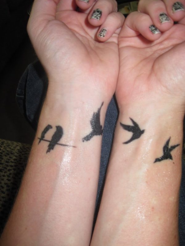 Flying Birds Tattoos On Girl Wrists