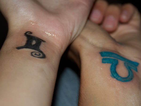 Gemini And Blue Ink Libra Zodiac Tattoo On Wrists