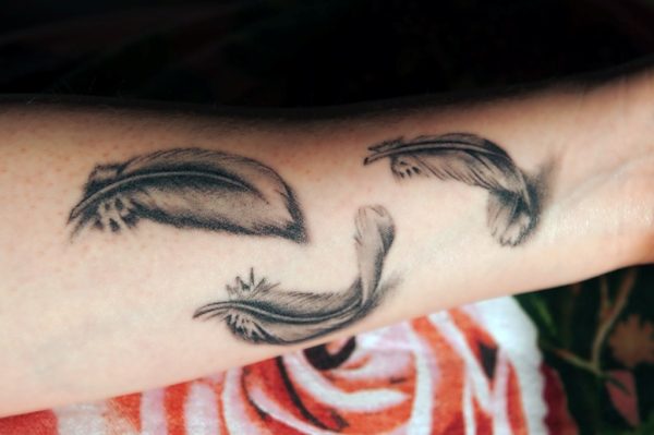 Grey Ink Feather Tattoo