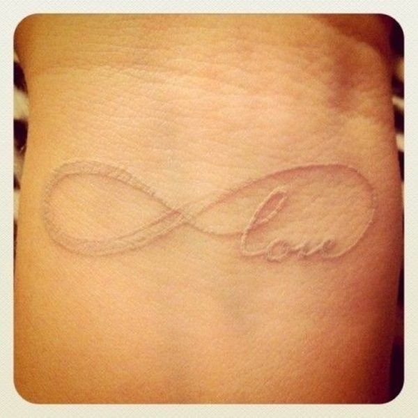 Infinity Love White Ink Tattoo On Wrist