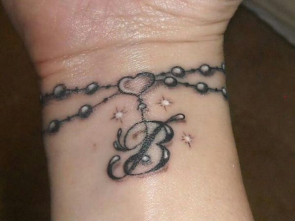 Initials Tattoo Design On Wrist