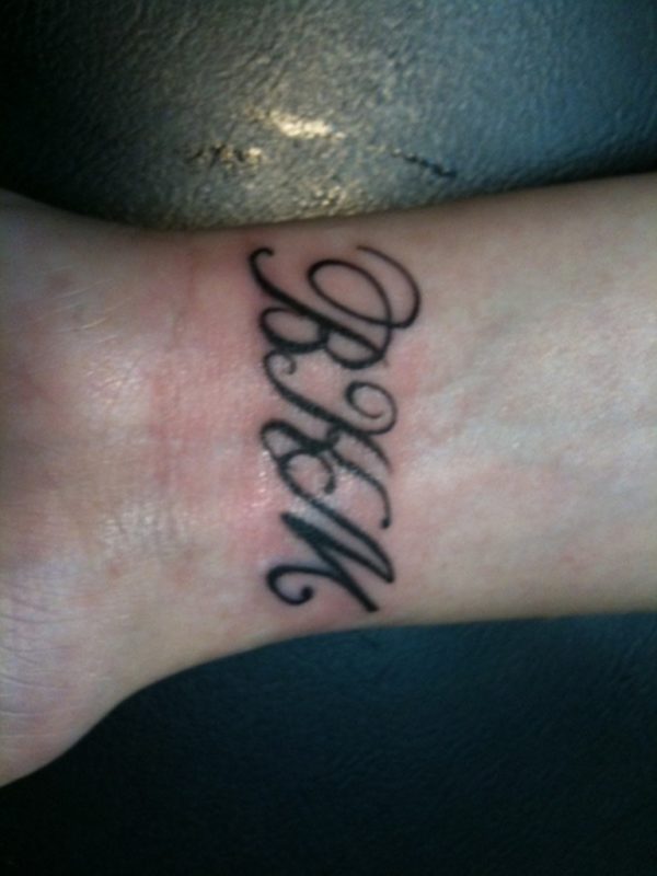 Initials Word Tattoo On Wrist