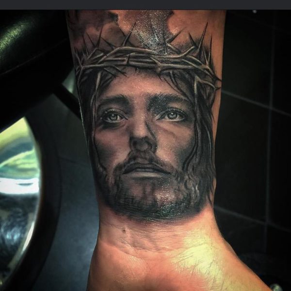 Jesus Face Tattoo On Wrist