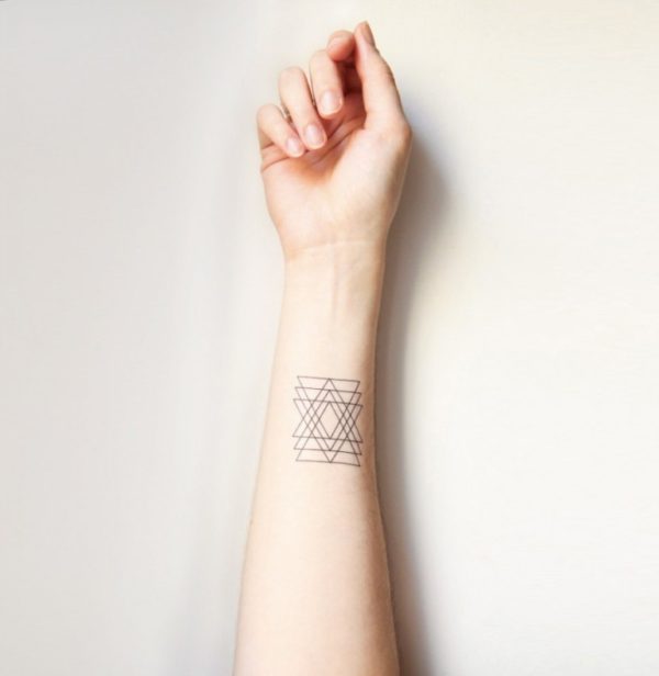 Light Black Ink Tattoo On Wrist