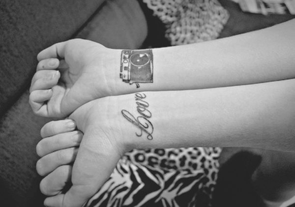 Love And Camera Tattoo On Wrist