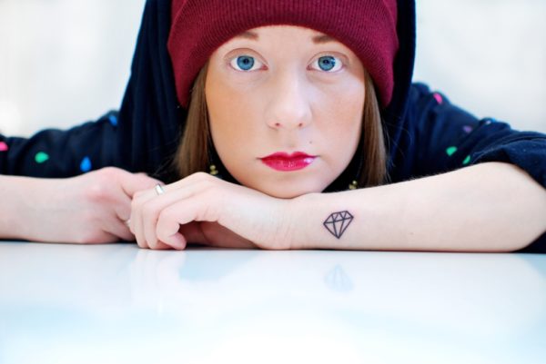 Lovely Girl With Cute Diamond Tattoo On Wrist