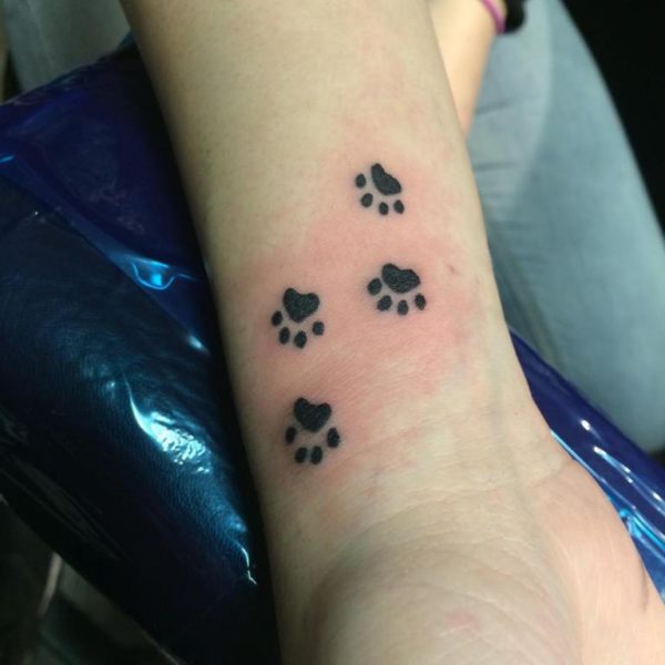 Multiple Paw Tattoo On wrist