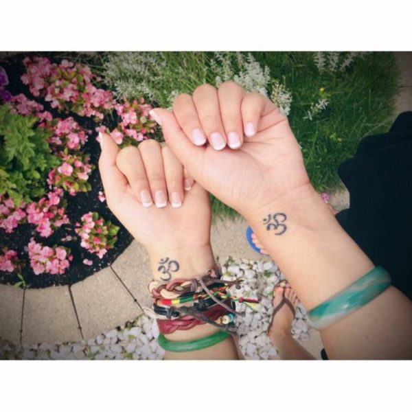 Om Tattoo On Girls Wrist
