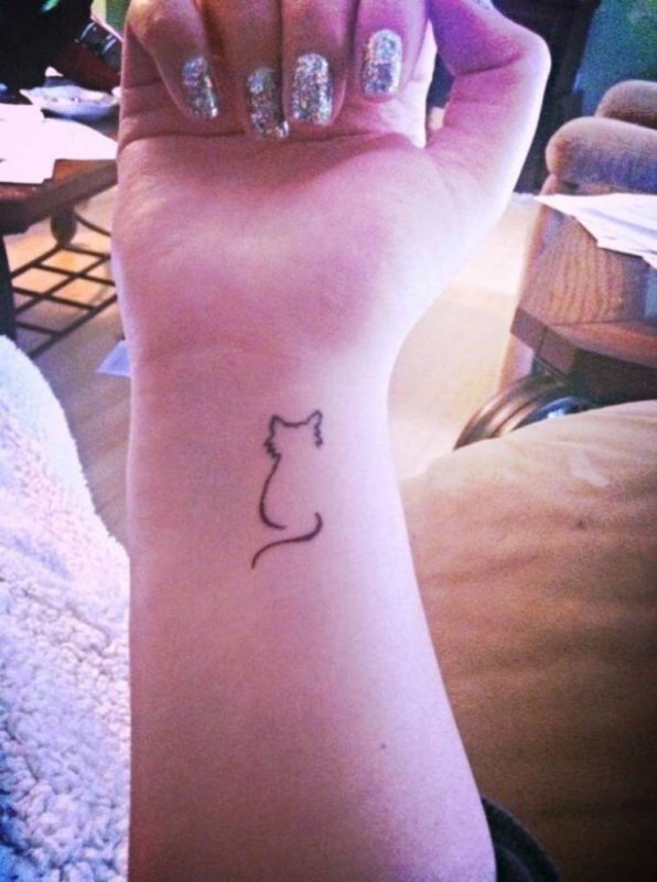 Outlining  Cat Tattoo On Wrist