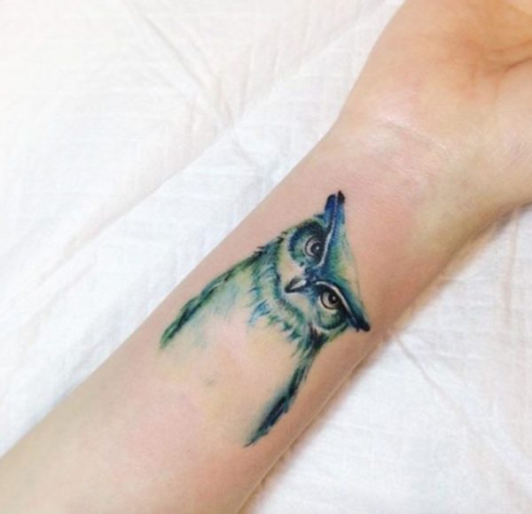 Owl Face Tattoo On Wrist