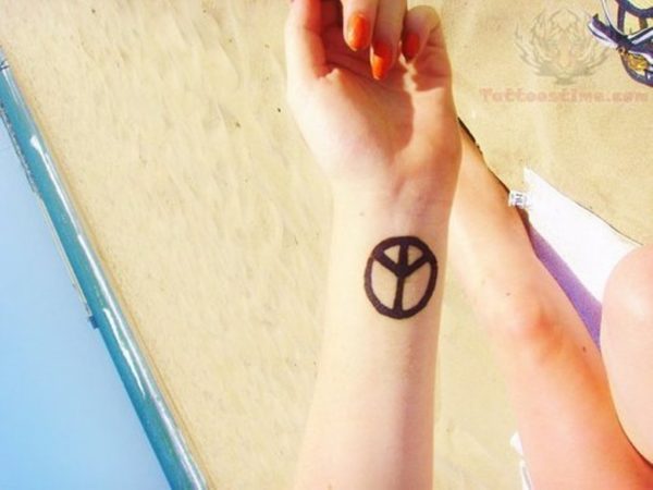 Peace Sign Tattoo On Wrist