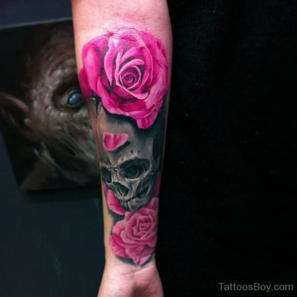 Pink Rose And Skull Tattoo On WristPink Rose And Skull Tattoo On Wrist