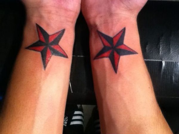 Red And Black Tattoo On Wrist