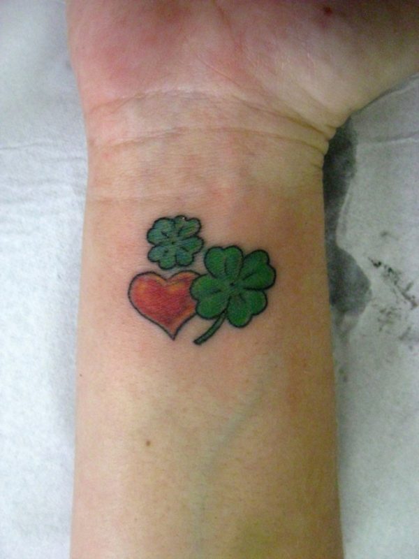 Red And Green Heart Tattoo On Wrist