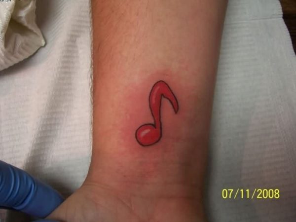 Red Ink Music Note Tattoo