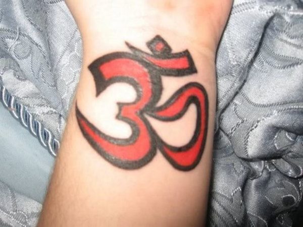 Red Om Tattoo On Wrist