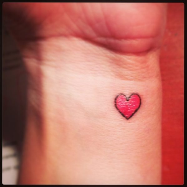 Red Shinning Heart Tattoo On Wrist