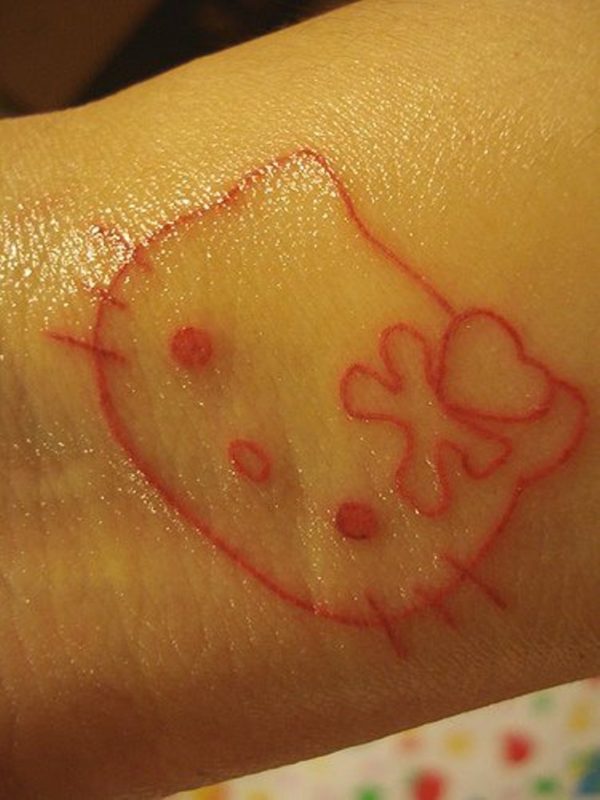 Red ink kitty Wrist Tattoo