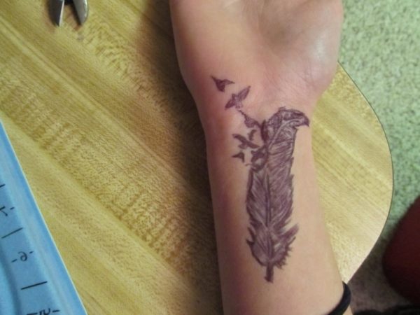 Simple Feather Tattoo on Wrist