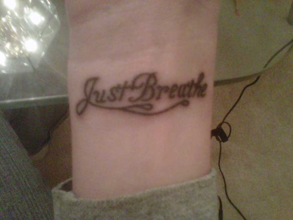 Simple Just Breathe Lettering Tattoo On Wrist